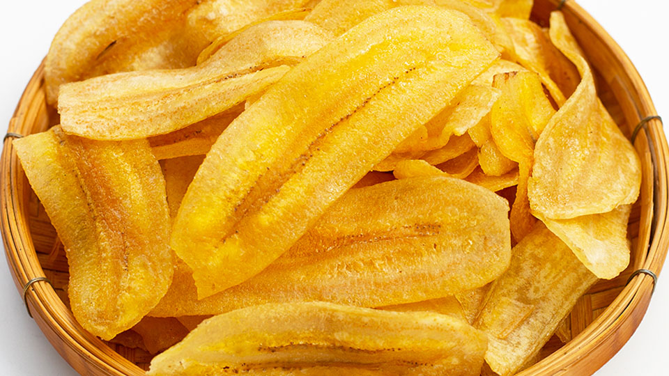 Banana slice chips on white background.